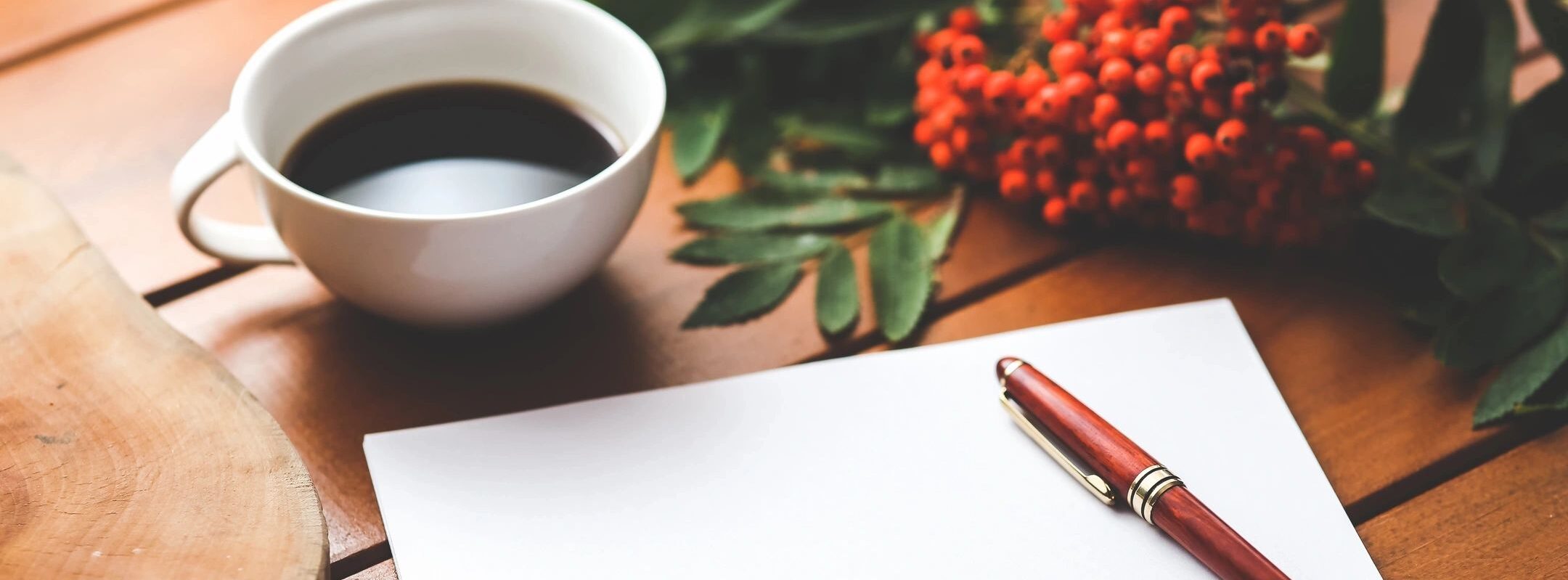 Picture from Beverly Chappell Thoughts Matter NLP and Hypnotherapy Testimonials page showing a cup of coffee and a note pad and pen